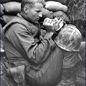 soldier feeding baby kitten.jpg
